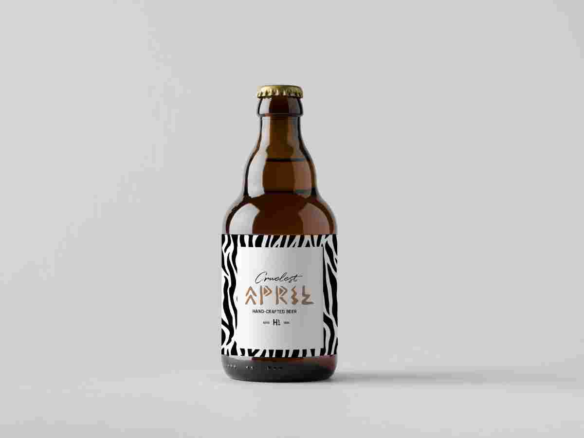 A bottle of beer with the label " april ".